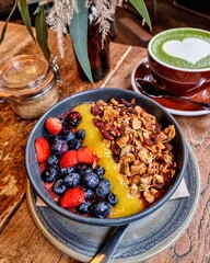 A beautifully presented meal and a refreshing beverage served at a modern restaurant, showcasing the rich flavors and vibrant dining culture