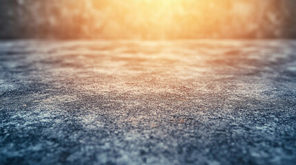 A textured, weathered grey concrete background symbolizing resilience, imperfection, and timelessness, evoking a sense of emptiness and potential, with blurred modern elements creating contrast.

