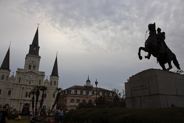 Building façades, historical architecture, and city streets in downtown New Orleans. 