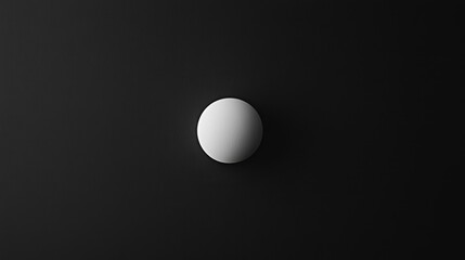 Minimalist abstract with a bold white circle on a deep black background, emphasizing simplicity