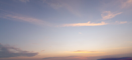 Beautiful morning or evening blue and orange sky with cloudy while sunsets or sunrises taken at the sea used as natural blackground texture