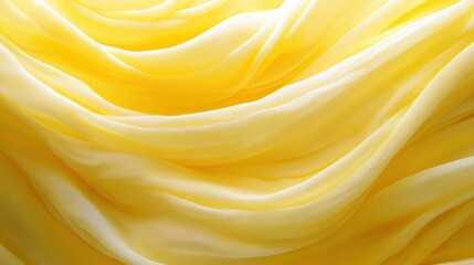 Obraz premium Soft yellow fabric draping elegantly with smooth folds