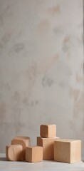 Simple Wooden Blocks Arranged on a Light Surface Against a Neutral Background