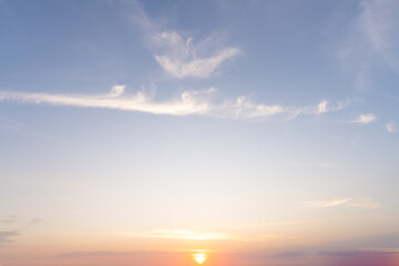 Beautiful morning or evening blue and orange sky with cloudy while sunsets or sunrises taken at the sea used as natural blackground texture