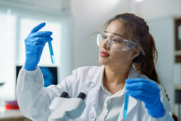 Female Scientist Analyzing Chemical Samples in Laboratory