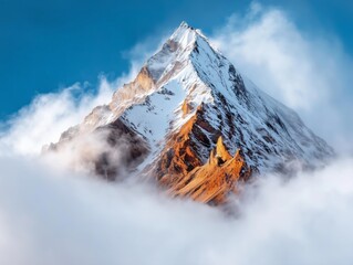 Snowy mountain peak emerging through thick white clouds.
