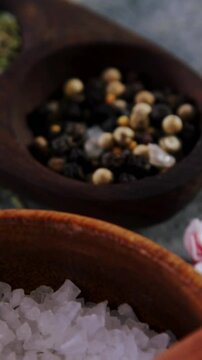 Close-up of salt, speice, black pepper, garlic and herbs