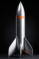 a close up of a silver and orange rocket on a black background