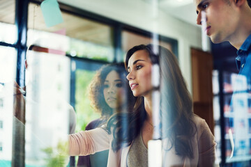 Brainstorming, creative and group in office, collaboration and teamwork for project or public relations. Discussion, people and colleagues with sticky notes for ideas, editor or planning for campaign