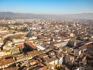 Aerial panoramic view of Florence, Italy, the historic city center with terracotta rooftops and Renaissance architecture from Brunelleschi Dome. Dense urban layout of Tuscan capital 
