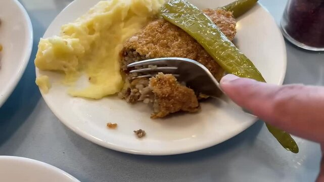 Close-Up Shot of Traditional Turkish Icli Kofte Being Gently Cut With a Fork