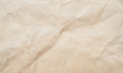 Crumpled piece of brown paper grunge background. Recycled craft paper texture background.