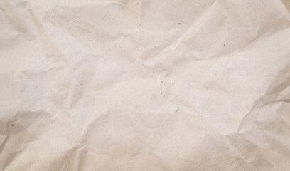 Crumpled piece of brown paper grunge background. Recycled craft paper texture background.
