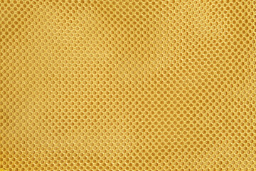 Yellow mesh abstract pattern and texture background. Mesh net accessories on women's purses. For graphic design or banner background