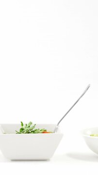 Three bowls of cooked pastas with forks