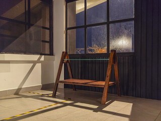A wooden chair by window with beautiful light
