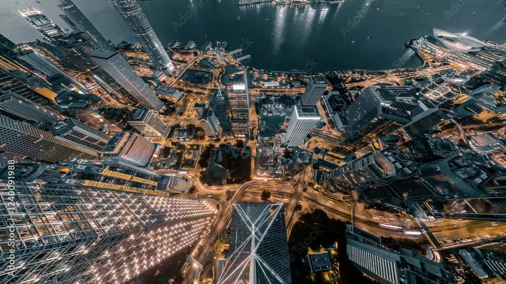 Poster a stunning 4k still video captures a zoomed-out aerial view of hong kong's vibrant cityscape at nigh