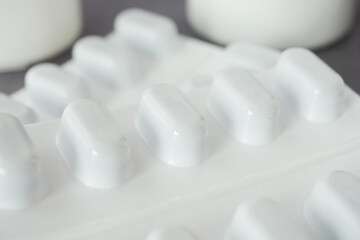White pills arranged in a clean setting