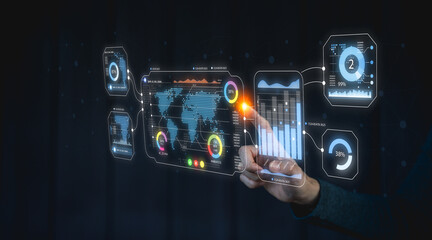 A futuristic interface with data visualizations and graphs, controlled by a hand, indicating advanced technology and data analysis.