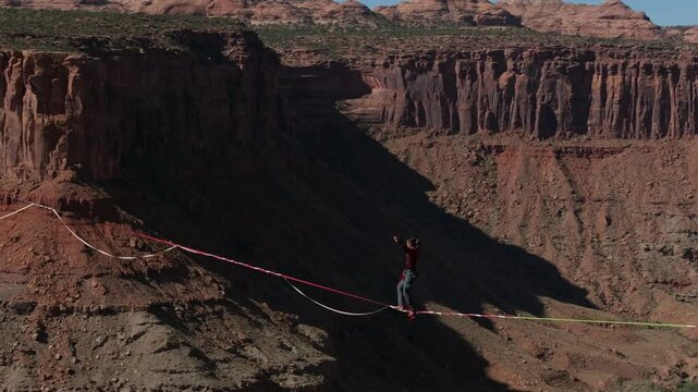 Slacklining over a canyon in Moab, Utah, showcasing a thrilling outdoor sport