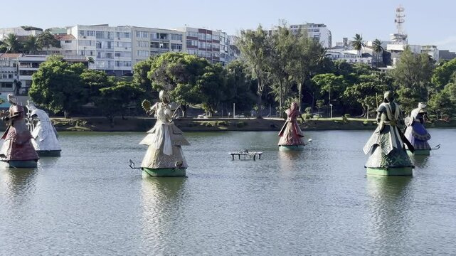 Sacred Orisha statues in a lake in Salvador de Bahia, Brazil, celebrating Afro-Brazilian culture, Candombl&eacute;, and the spiritual energy of the Orix&aacute;s, especially Yemanj&aacute; during celebrations.