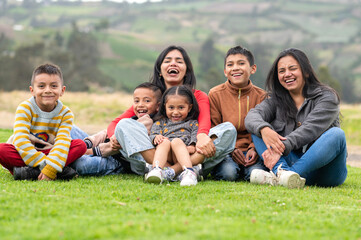 Happy latin american family enjoying time together outdoors