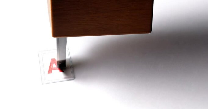 Official Rubber Stamp Pressing Bold Red 'APPROVED' on White Paper with Alpha Channel


