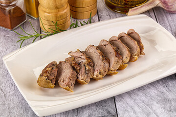 Roasted duck breast slices in the plate