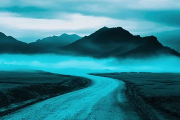 Gardinen Misty mountain road winding serene blue landscape © volga