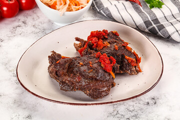 Baked beef cheeks with vegetables