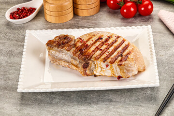 Grilled pork loin steak with bone