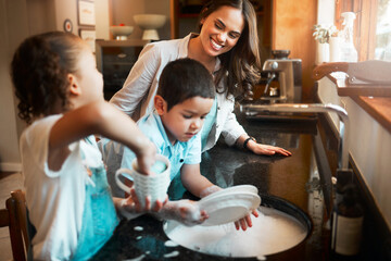 Kitchen, mom and washing dishes with children, smile and teaching responsibility to kids and...