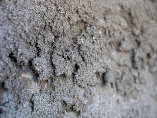 A wall with a grey surface