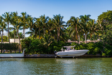 Docked yacht at private area. Sea vacation on summer. Luxury boat motor yacht in marina. Luxury yacht at private house. Boating and yachting tourism. Luxurious lifestyle. Vacation on summer