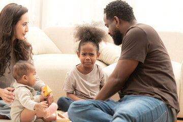 Parents and children relax during their holiday at home