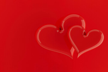 Couple red bright glossy balloon hearts flying on red background, copy space. Valentine's day background. Romantic sweet heart. 3D illustration for advertising, design, poster, card, flyer.