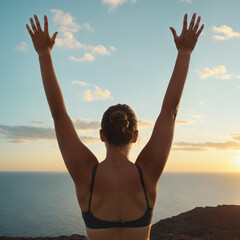 woman stretching arms high on a coastal cliff, motivation