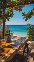 Fototapeta premium Relaxing wooden table with a view of the turquoise ocean under a clear blue sky