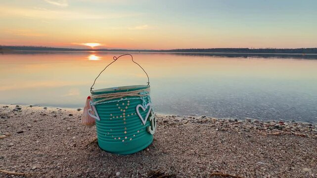 romantic lantern with candle in a vintage can on the romantic beach
