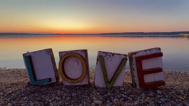 happy Valentines Day - colorful LOVE letters on the beach in sunset natural light