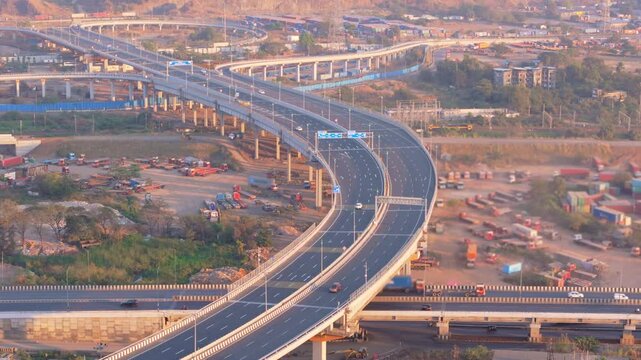 Drone shot elevated of road system along moving vehicles