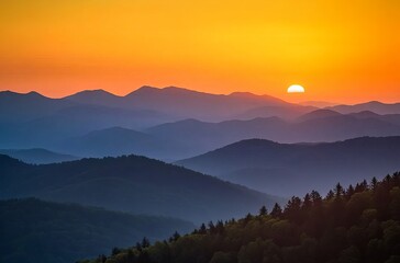 Sunset over the Carpathian Mountains, silhouettes of hills and forests against an orange sky with the sun setting in view. The mountains cover most of the frame sunset in the mountains