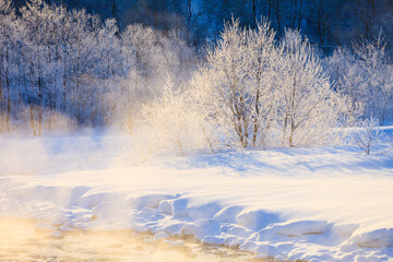 winter landscape with frost trees and river