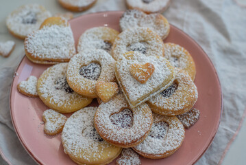 Linzer cookies with heart with raspberry jam and powdered sugar 