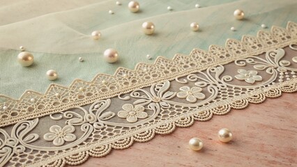 Obraz premium Ornate lace border with scattered pearls on pastel fabric, dreamy nostalgic effect
