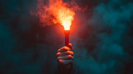 closeup of a hand holding a flare against a dark background