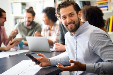Diverse employees gathered in the office having fun during brainstorming while discussing new ideas