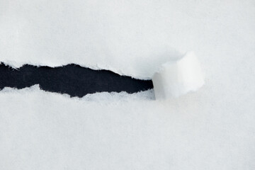 White Torn Paper on Black Background
