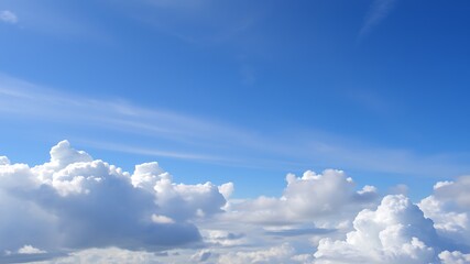 Fototapeta premium A breathtaking panoramic view of fluffy cumulus clouds against a vibrant blue sky, perfect for illustrating serenity and tranquility.