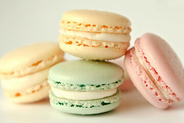 Fototapeta premium Delicious colorful macarons on white background